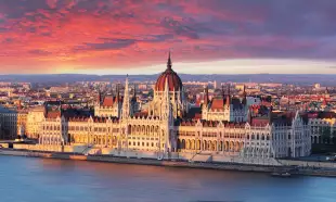 Aerial view of parliament building at dramatic sunrise in Budapest, Hungary